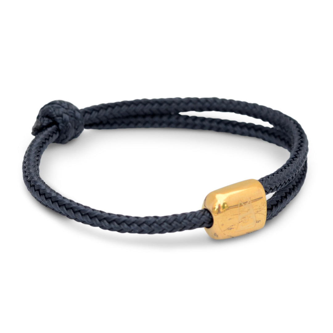 Limited Edition Cuttyhunk: An adjustable navy nautical rope bracelet in custom USA-made double braid line with gold-plated 316L stainless steel hardware.