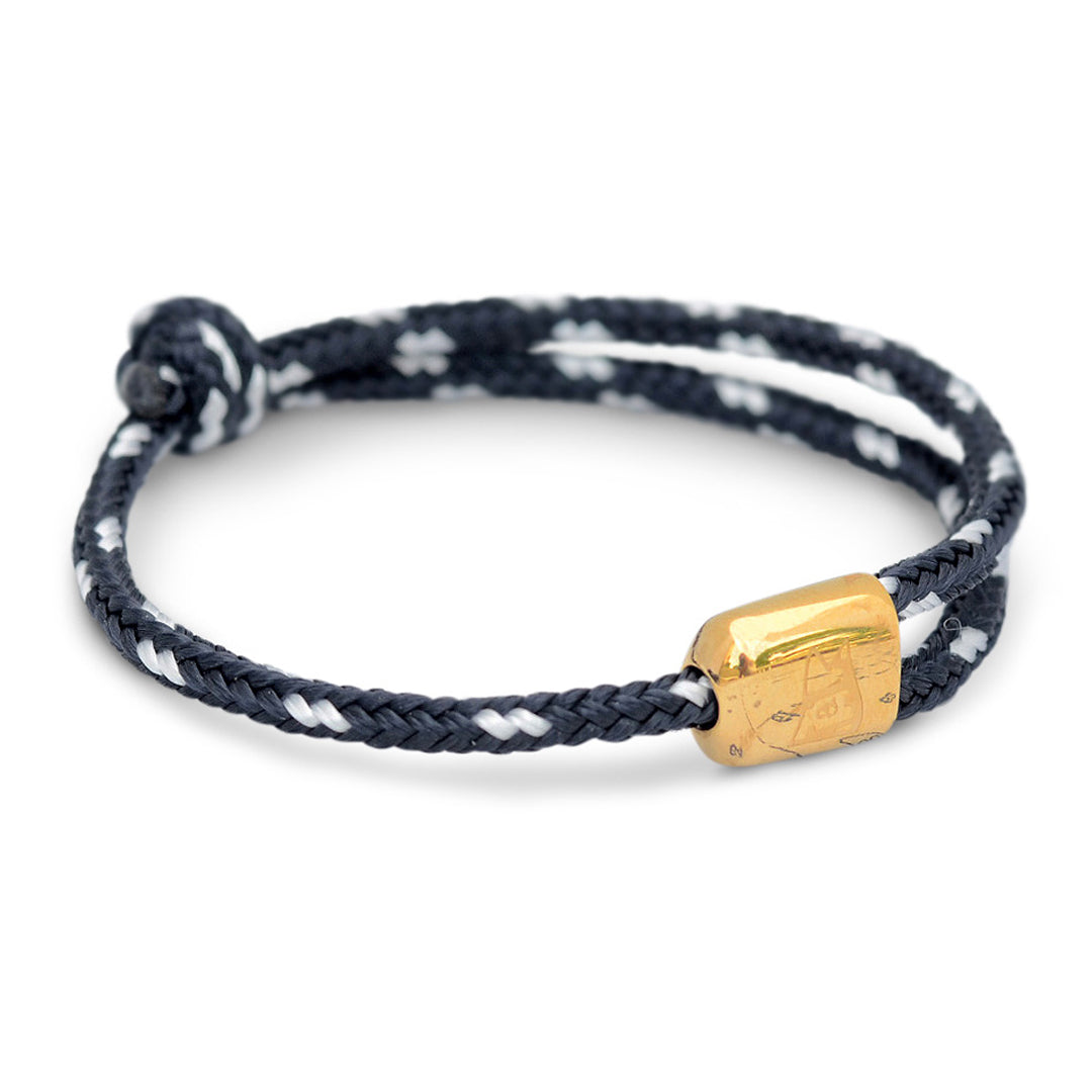 Limited Edition Cuttyhunk: An adjustable navy and white nautical rope bracelet in custom USA-made double braid line with gold-plated 316L stainless steel hardware.
