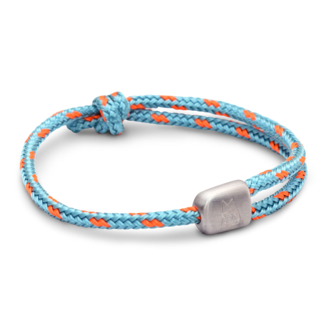 The Cuttyhunk Collection: An adjustable sky blue and signal orange nautical rope bracelet in custom USA-made double braid line with 316L stainless steel hardware.