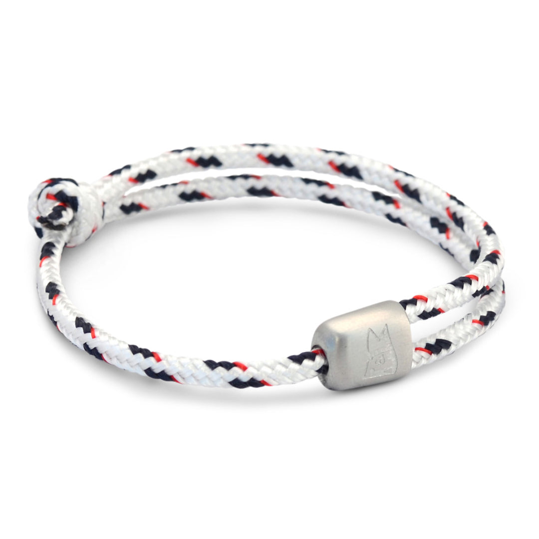 The Cuttyhunk Collection: An adjustable white and navy nautical rope bracelet in custom USA-made double braid line with 316L stainless steel hardware.