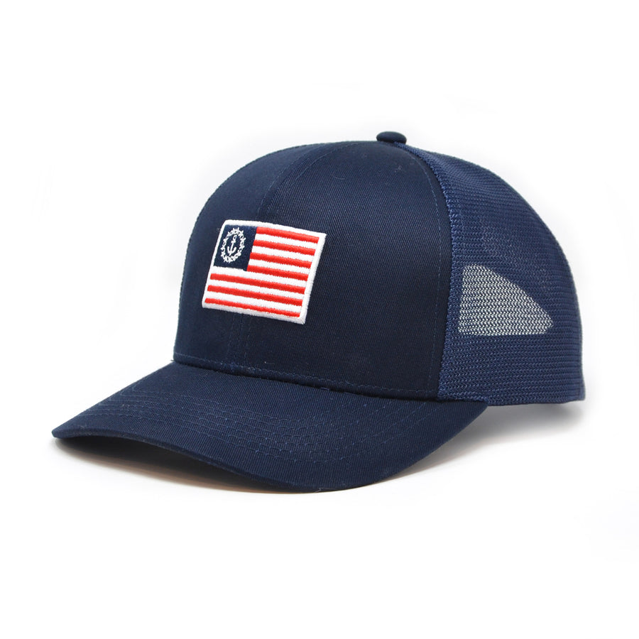 Ensign Navy Trucker Hat: A 6-panel structured mesh back hat with a mid-profile fit and snapback closure.