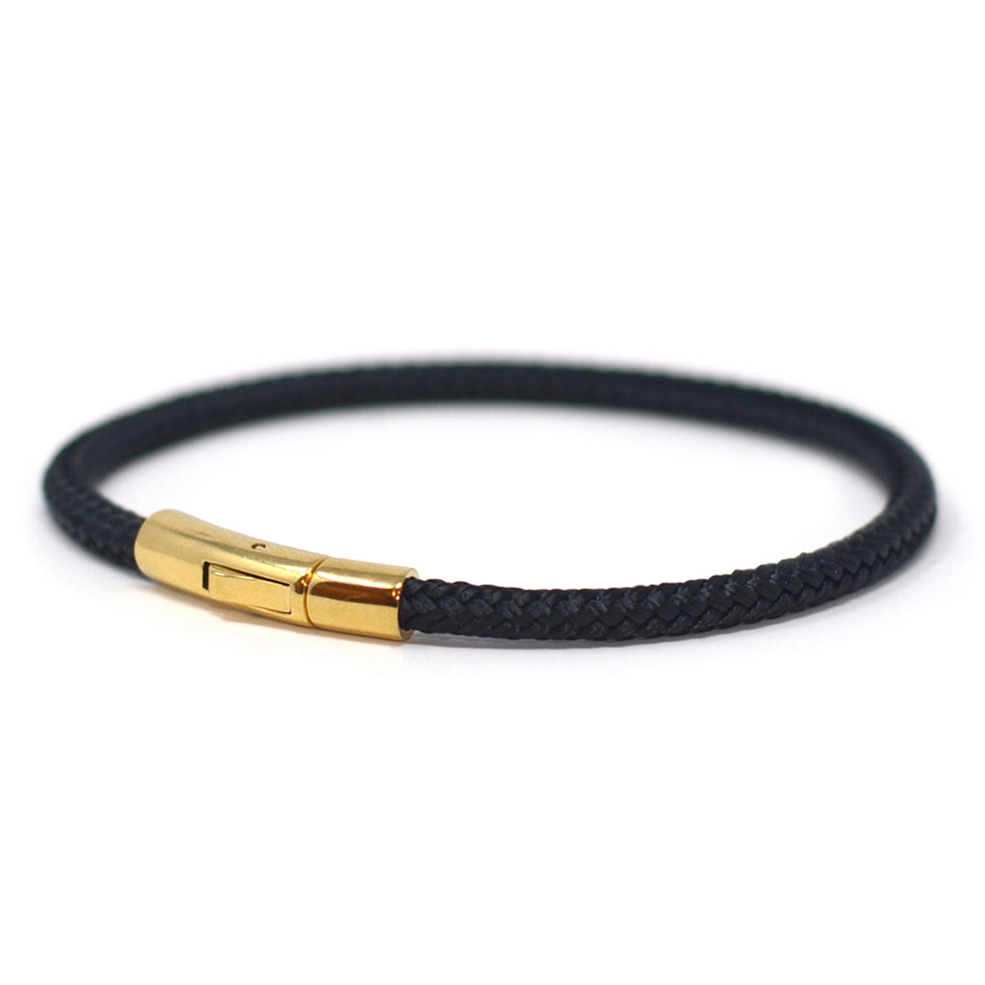 The Chatham Collection: A streamlined black nautical bracelet handcrafted with custom USA-made line and 316L gold stainless steel hardware by Lemon & Line.