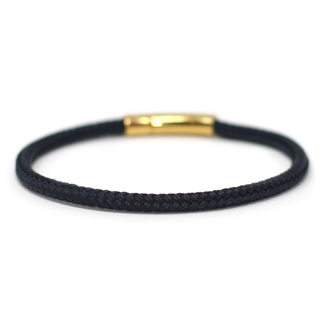 The Chatham Collection: A streamlined black nautical bracelet handcrafted with custom USA-made line and 316L gold stainless steel hardware by Lemon & Line.