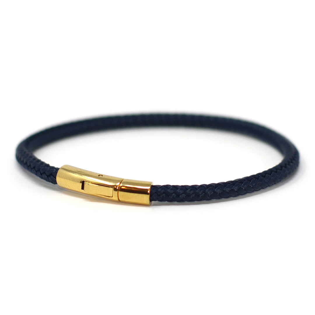 The Chatham Collection: A streamlined navy nautical bracelet handcrafted with custom USA-made line and 316L stainless steel gold hardware by Lemon & Line