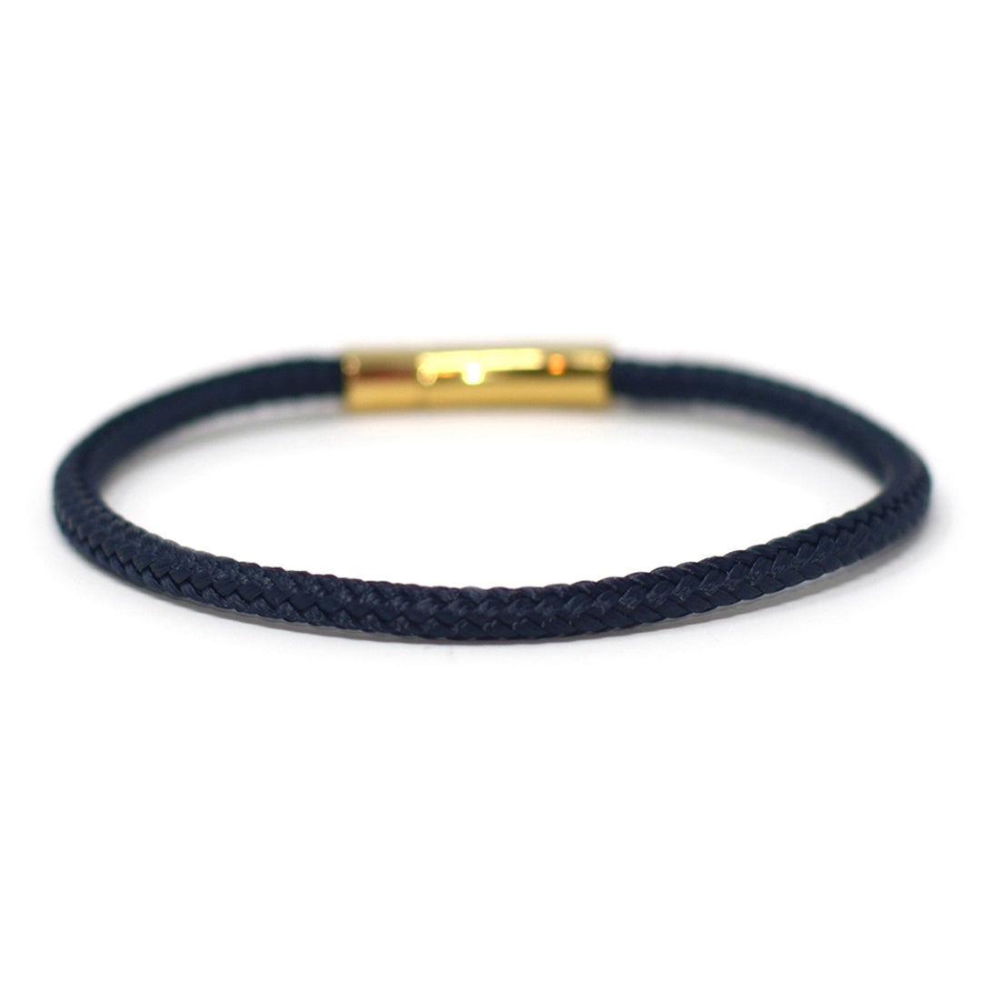 The Chatham Collection: A streamlined navy nautical bracelet handcrafted with custom USA-made line and 316L stainless steel gold hardware by Lemon & Line