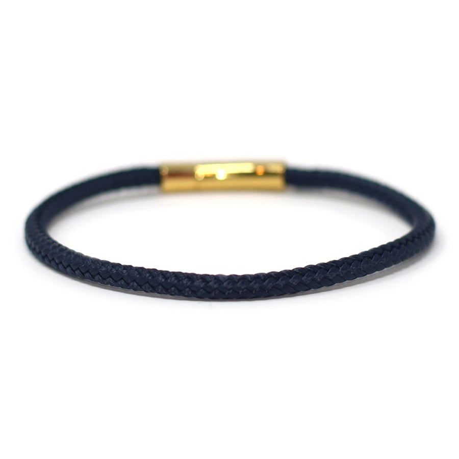 The Chatham Collection: A streamlined navy nautical bracelet handcrafted with custom USA-made line and 316L stainless steel gold hardware by Lemon & Line