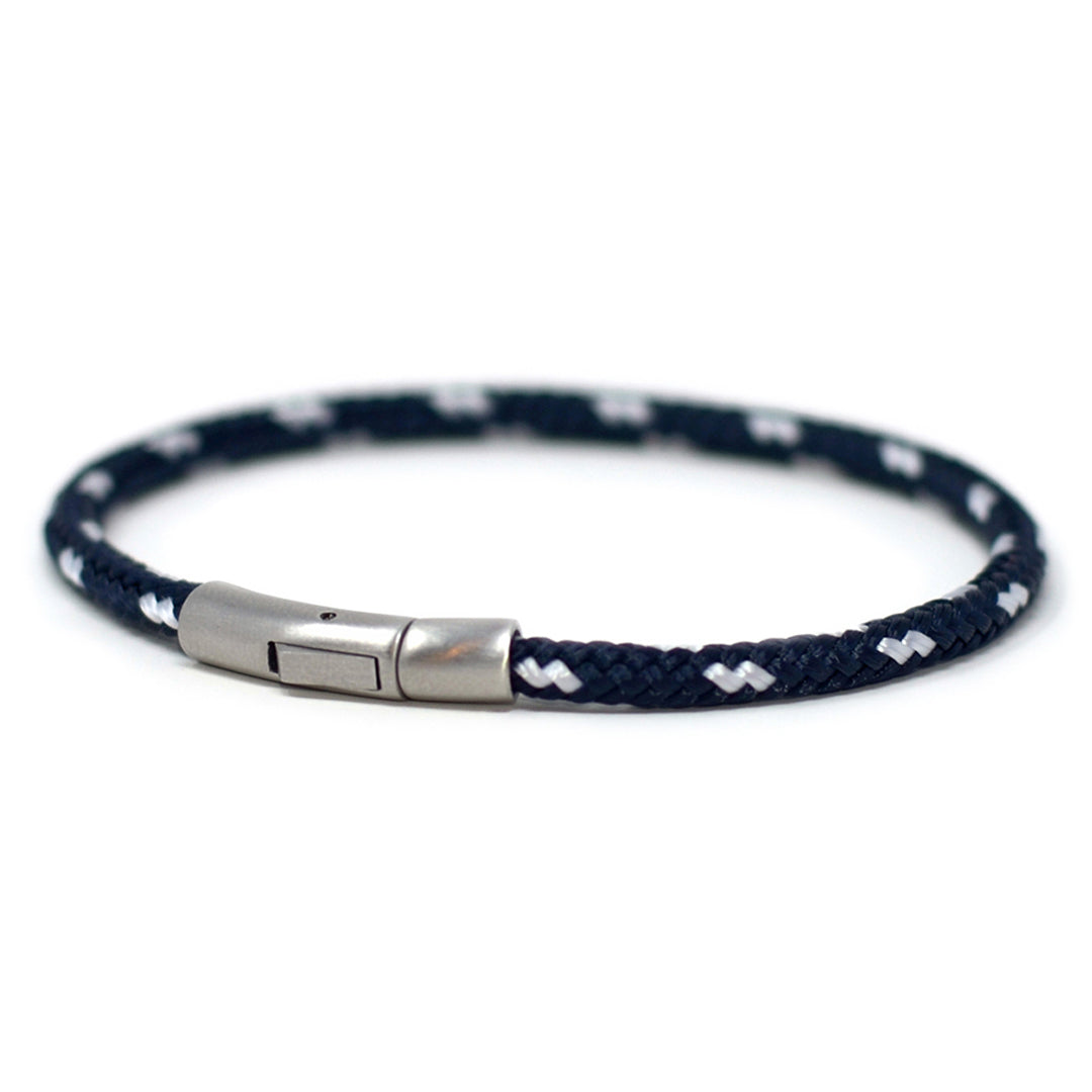 The Chatham Collection: Our streamlined navy blue and white nautical rope bracelet featuring a 316L stainless steel clasp and custom USA-made line.