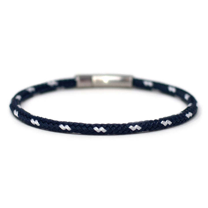 The Chatham Collection: Our streamlined navy blue and white nautical rope bracelet featuring a 316L stainless steel clasp and custom USA-made line.