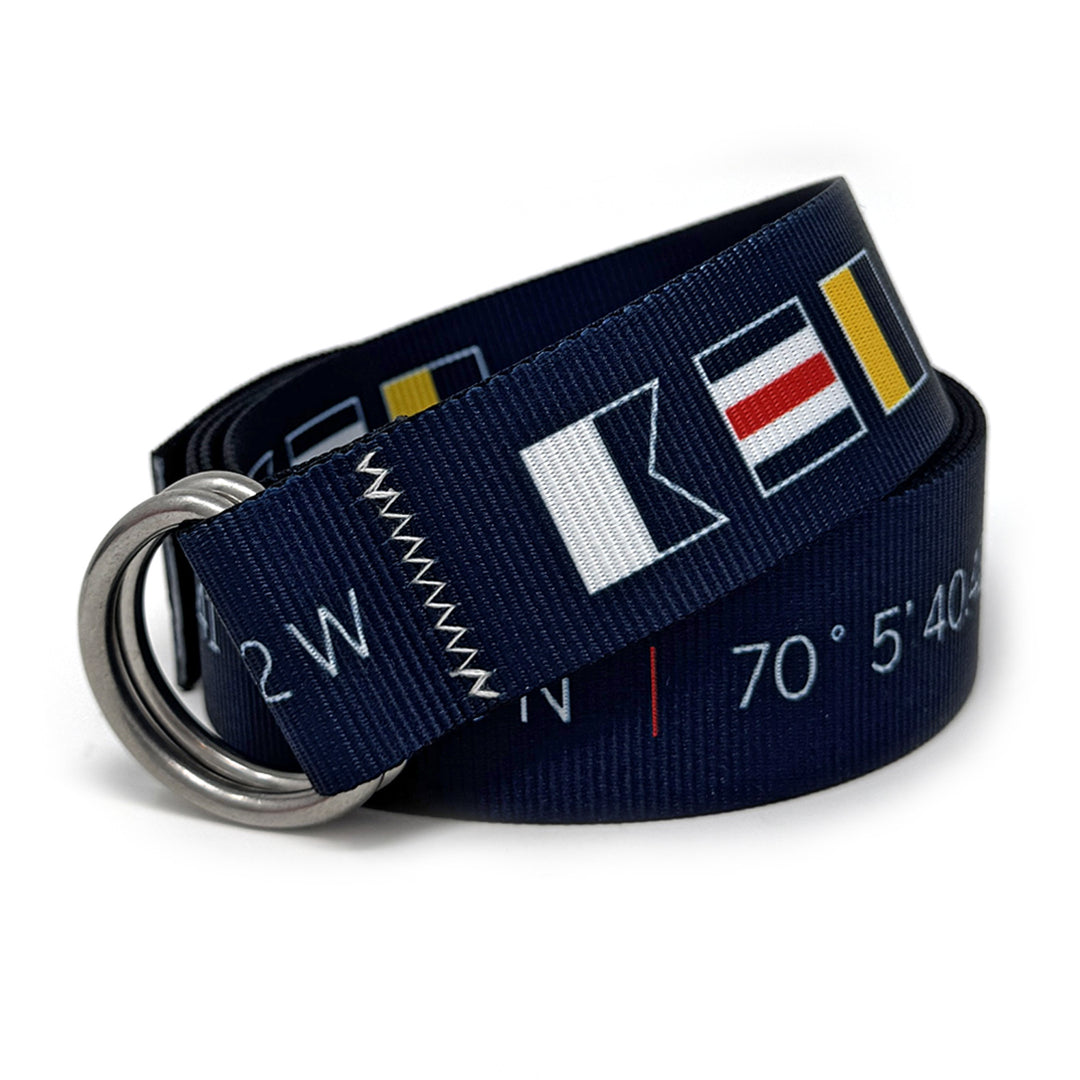 Nantucket lat/long Belt: A navy blue 1.5" marine-grade webbing belt featuring signature zig-zag stitching and 316L stainless steel d-rings.