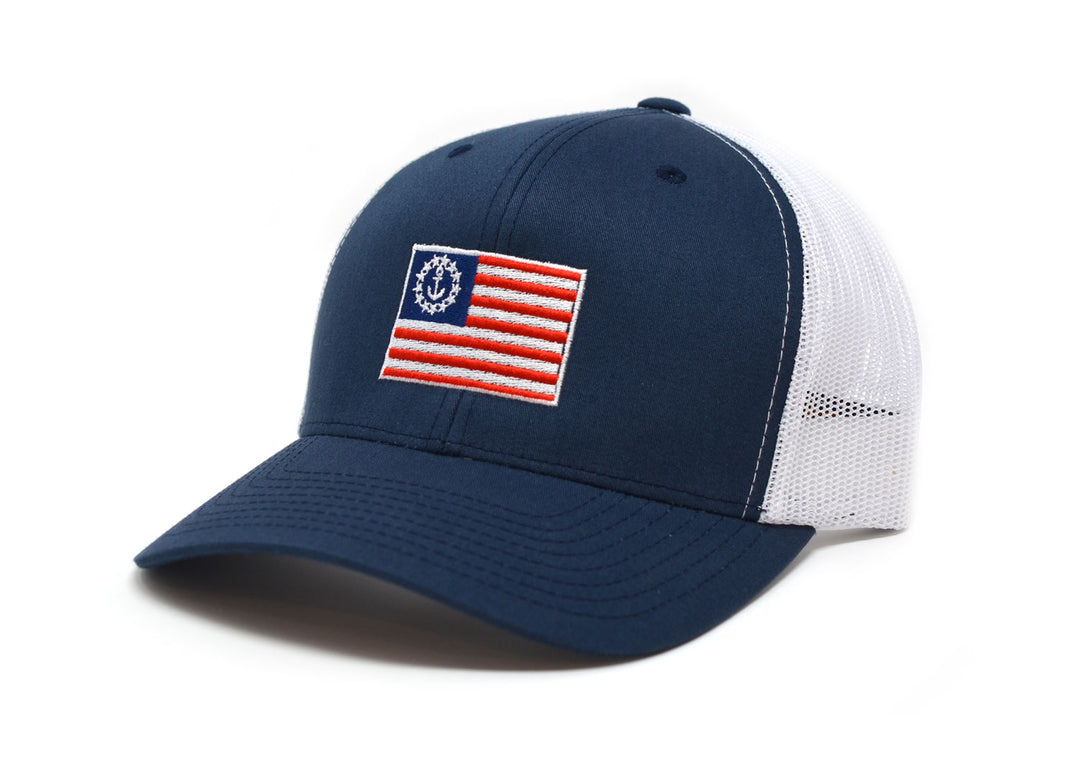 Ensign Navy Trucker Hat: A 6-panel structured mesh back hat with a mid-profile fit and snapback closure.